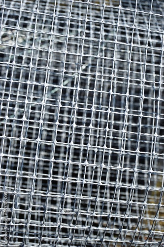 Gray galvanized metal screen layers abstract vertical background texture