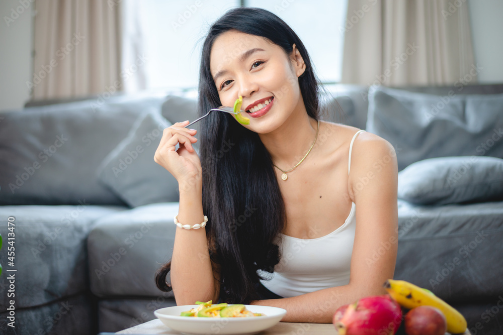young Asian woman girl holding health food fresh vegetable in lifestyle at home, female beautiful vegetarian person doing diet nourishment eat salad meal, people are smile happy, healthy food concept young Asian woman girl holding health food fresh vegetable in lifestyle at home, female beautiful vegetarian person doing diet nourishment eat salad meal, people are smile happy, healthy food concept