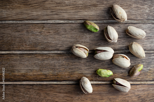 Pistachio nuts snack on wood background 72 dpi