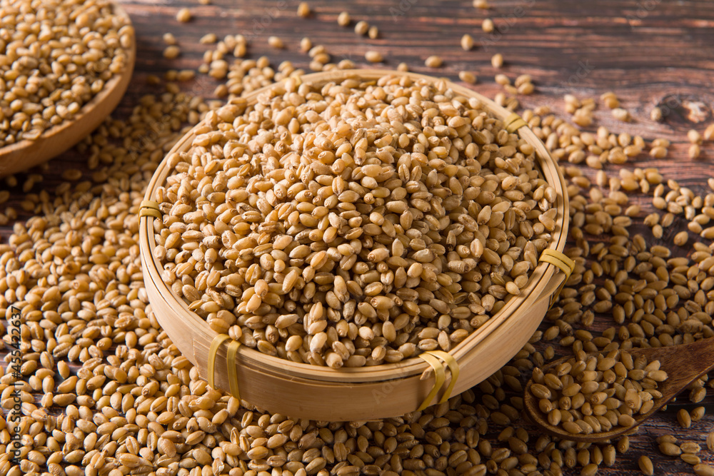 wheat grain on wooden background wheat grain on wooden background