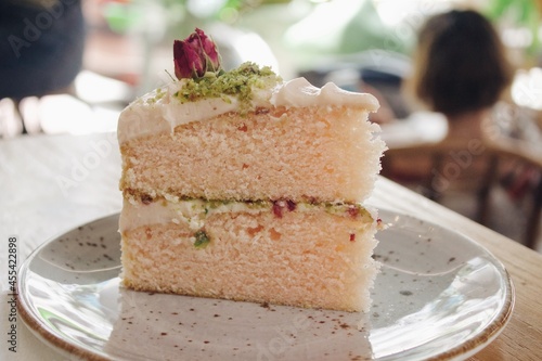 piece of rose and pistachio cake