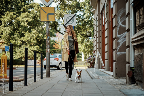 Woman walks with dog