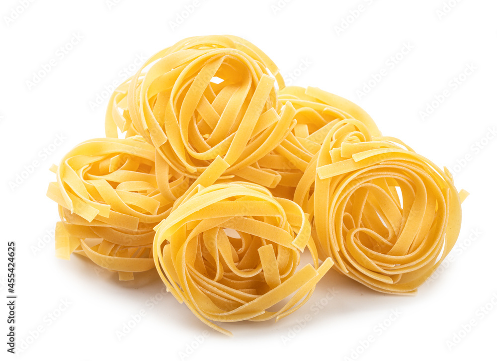 italian nest pasta fettuccine isolated on white background italian nest pasta fettuccine isolated on white background