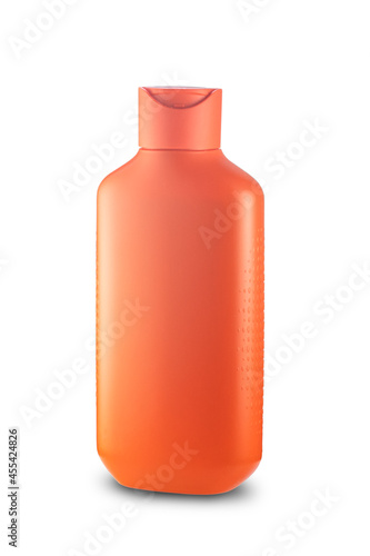 orange plastic bottle with shampoo. isolated on white background