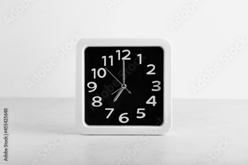 Stylish clock on white background