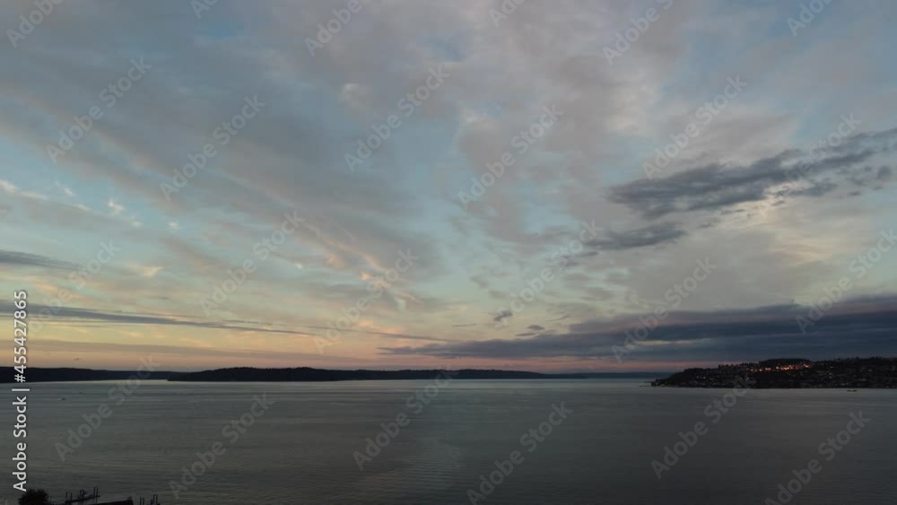 Gorgeous sunset with amazing clouds as seen by panning across Tacoma's Commencement Bay from Bowns Point looking West via drone. Gorgeous sunset with amazing clouds as seen by panning across Tacoma's Commencement Bay from Bowns Point looking West via drone.