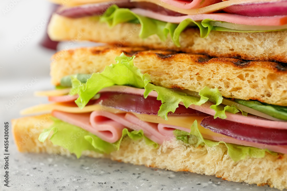 Tasty sandwiches on table, closeup Tasty sandwiches on table, closeup