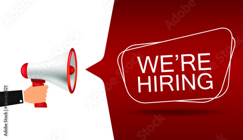 Hand Holding Megaphone With We Are Hiring Sign. Vector Illustration.