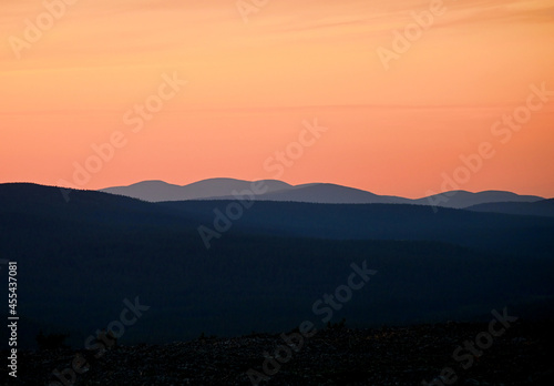 Beautiful evening sky above distant fells at sunset in Pallas-Ylläs National Park in Lapland, Finland.