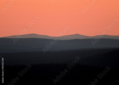 Evening blush above distant fells at sunset in Pallas-Ylläs National Park in Lapland, Finland.