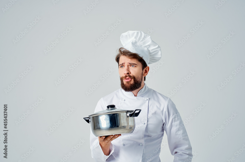 bearded male chef with a saucepan in his hands kitchen restaurant work bearded male chef with a saucepan in his hands kitchen restaurant work