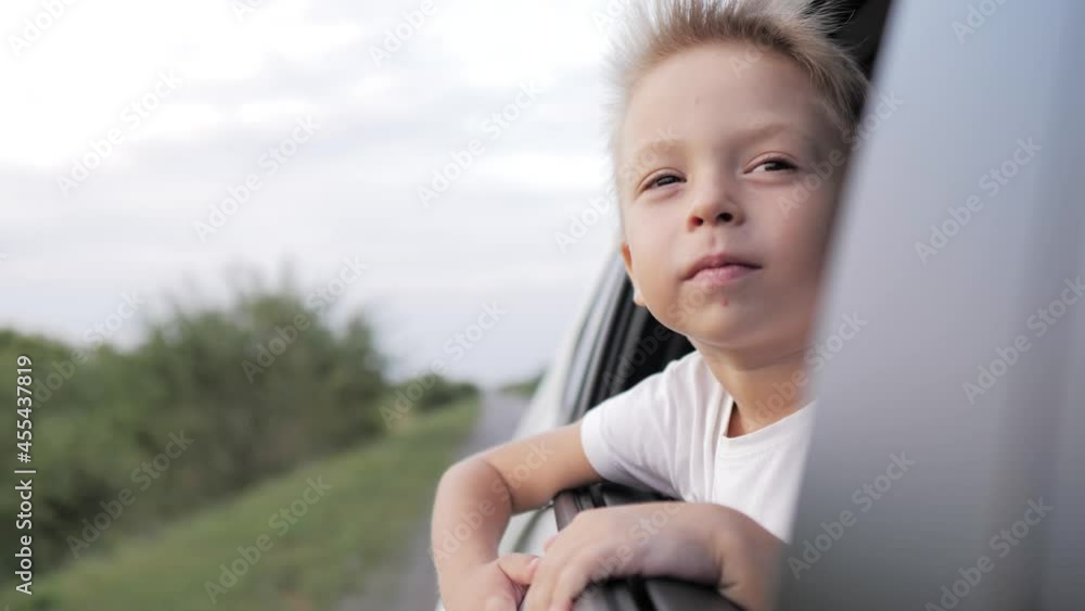 Family Car Trip. Happy little boy look out from car windows. Summer trip with family concept. Family Car Trip. Happy little boy look out from car windows. Summer trip with family concept.