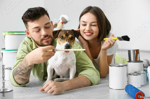 Young couple with cute dog ...
