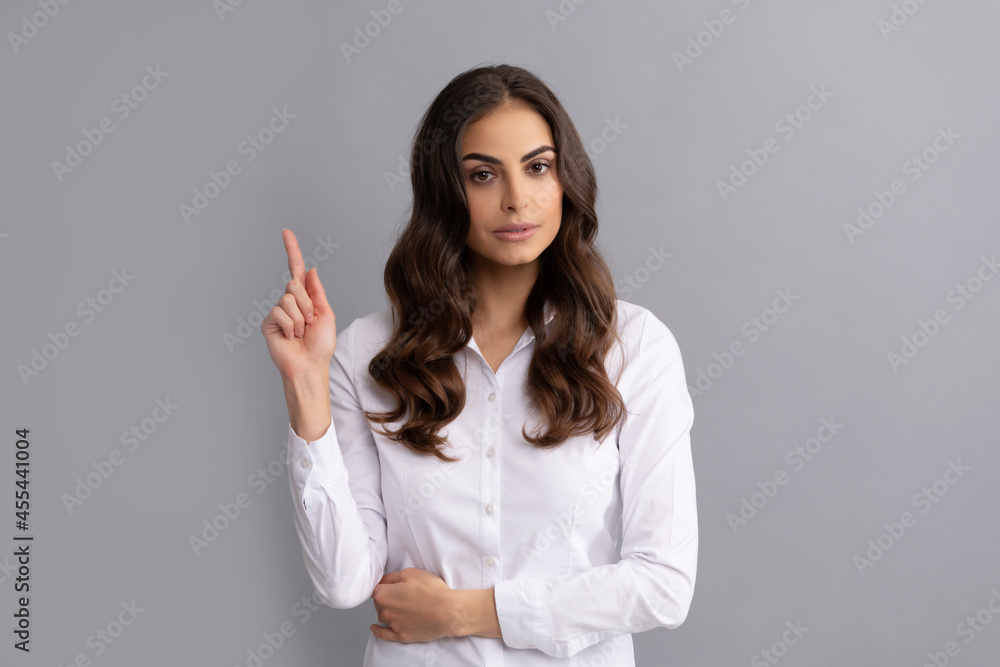 Trust your idea. Woman got idea. Career girl keep finger up. Eureka gesture. Genius at work Trust your idea. Woman got idea. Career girl keep finger up. Eureka gesture. Genius at work