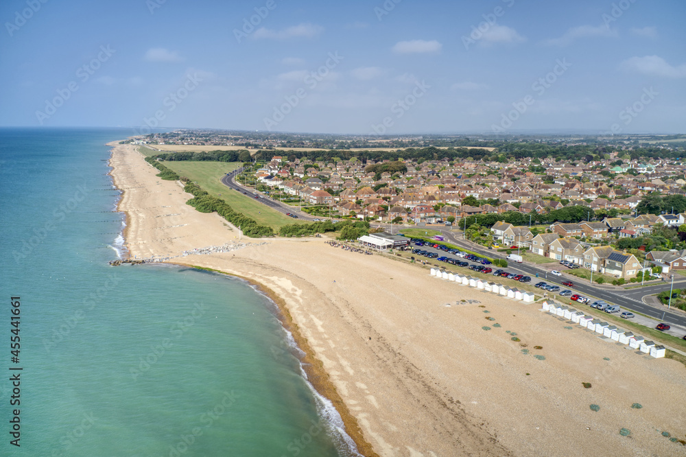 Goring by Sea beach with the Cafe in view and the greensward behind the beach at this popular seaside resort. Aerial view.