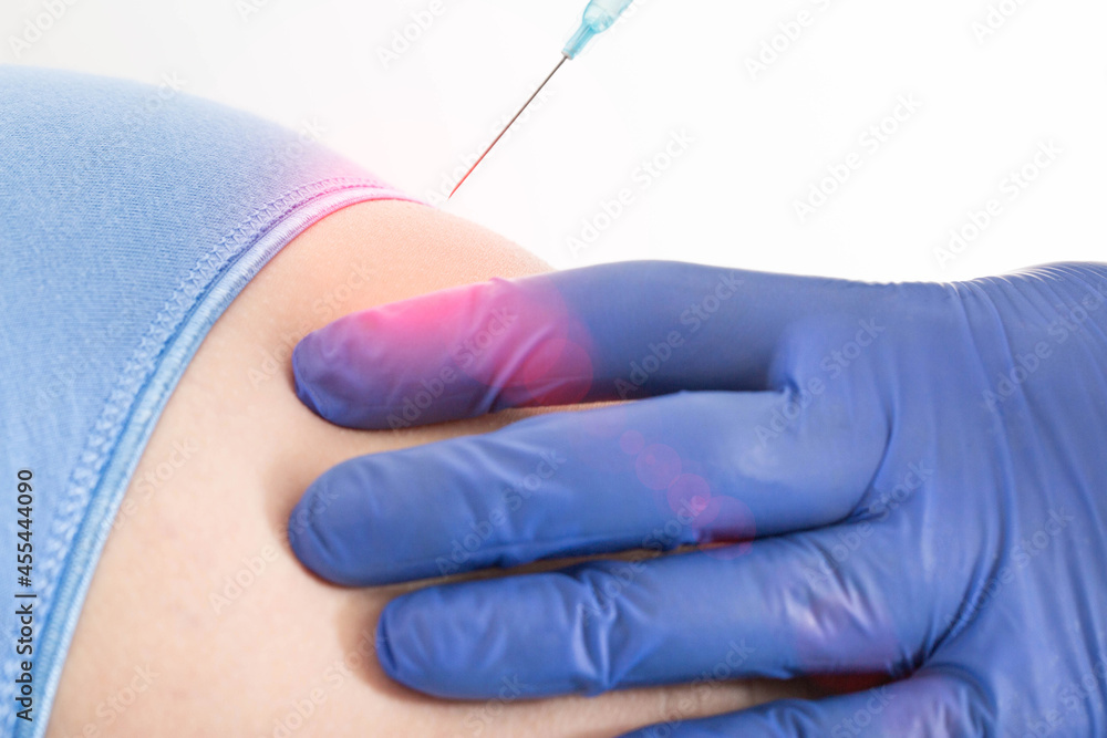 The doctor gives an anesthetic injection in the buttock for back pain ...