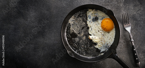 Fried chicken egg in a cast iron pan