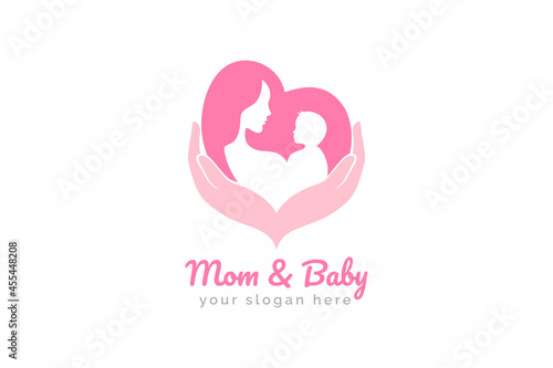 Mother and baby logo vector symbol. Mom hugs her child logo template