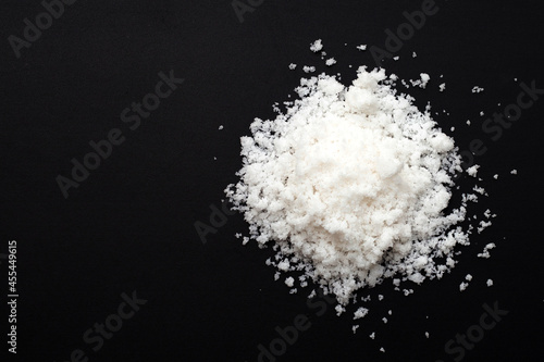 White salt on dark background.