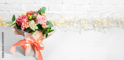  Summer bouquet of flowers on a white background with beautiful bokeh, free space for text. Bouquet of pink roses banner for website 