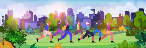 senior people group doing physical exercises in urban park aged men women training outdoor workout active old age