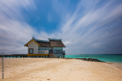 Crossroads Maldives, july 2021: view of luxury overwater villa, that lie within a sparkling turquoise lagoon offering views of either sunrise or sunset, beach or ocean view. Long exposure picture