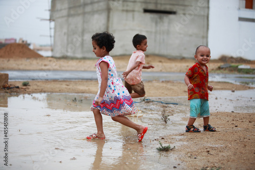 Children Playing Freedom Rainwater Puddle Splashing