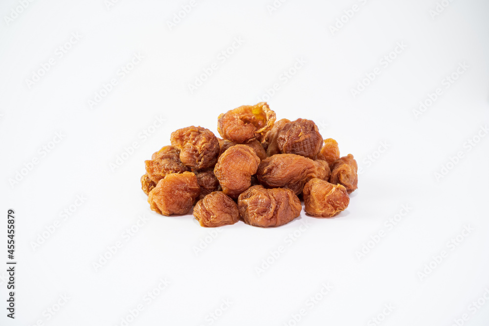 Dried longan isolated on white background. Dehydrated food isolated concept. Dried longan isolated on white background. Dehydrated food isolated concept.