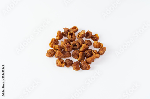 Dried longan isolated on white background. Dehydrated food isolated concept. 