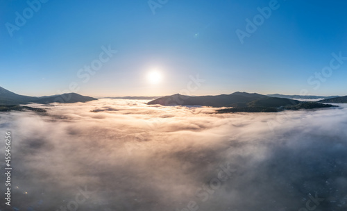 Banner panorama landscape Mountain with morning colorful fog sunrise, aerial top view