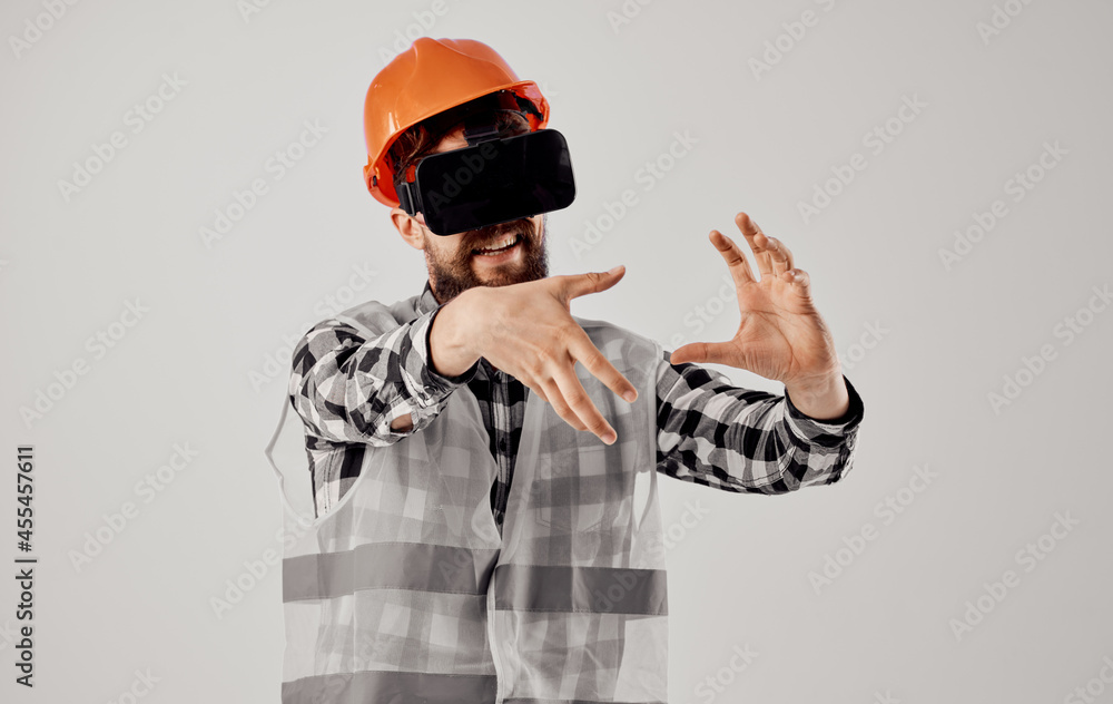 engineer in an orange helmet technology Professional light background engineer in an orange helmet technology Professional light background