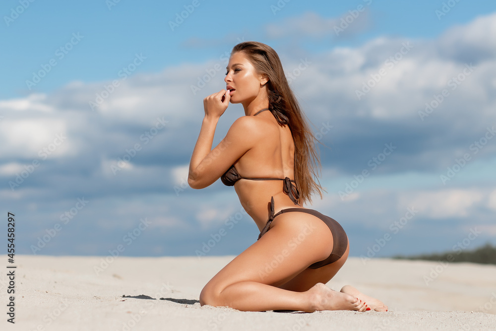 Woman, young, panty, sweaters, takes off, lake, beach, backside, gets along  detail, Stock Photo, Picture And Rights Managed Image. Pic. MBA-03936192