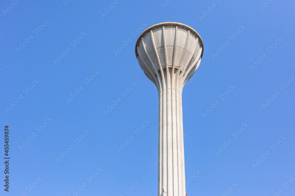 Tall High Water Tower Structure Storage Tank with Gravity Feed for Drinking to Residential homes.