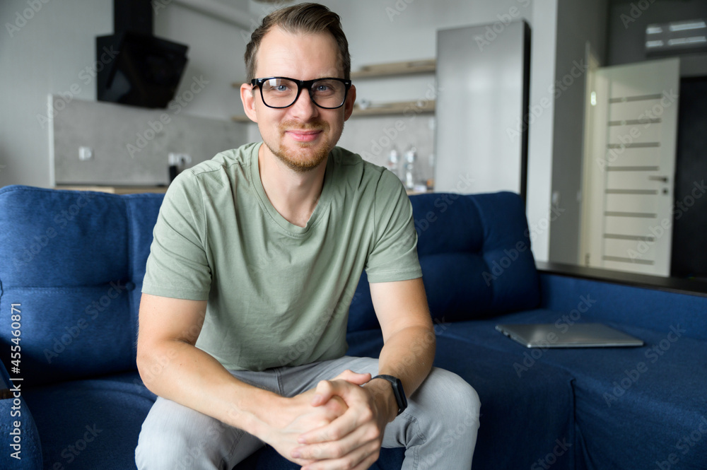 A head shot of a young happy man in casual shirt talking via video call, mentor, trainer conducts webinar, online class. Video meeting, virtual conference with an intelligent guy, webcam view A head shot of a young happy man in casual shirt talking via video call, mentor, trainer conducts webinar, online class. Video meeting, virtual conference with an intelligent guy, webcam view