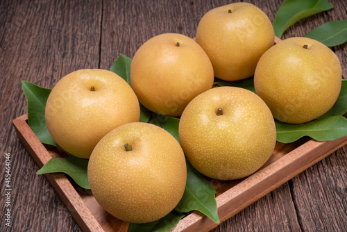 Snow pear or Shingo pear on a wooden background, Korean pear fruits delicious and sweet on wooden background.
