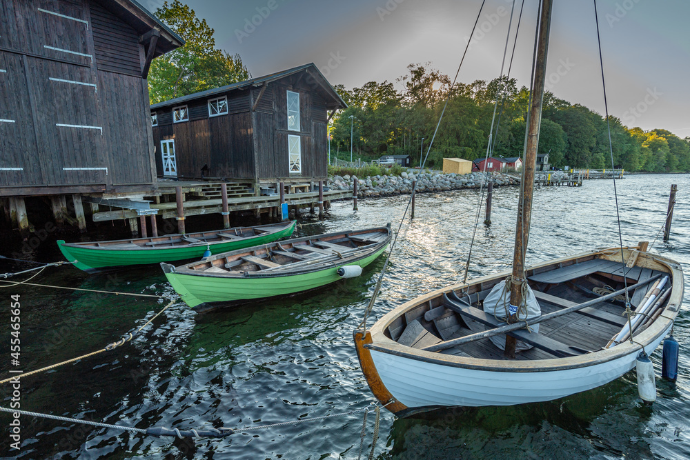 Denmark, Middelfart, 04-09-2021- Old and new wooden dinghies, are moored