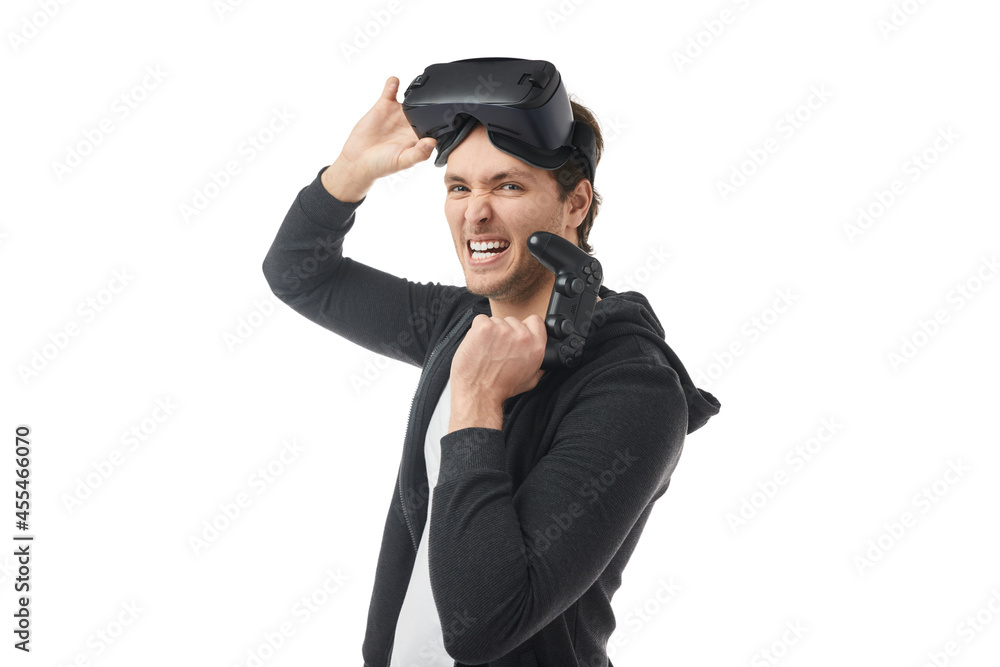 Excited gamer in VR headset with controller Excited gamer in VR headset with controller