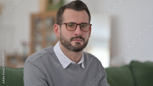 Middle Aged Man Looking at Camera, Home