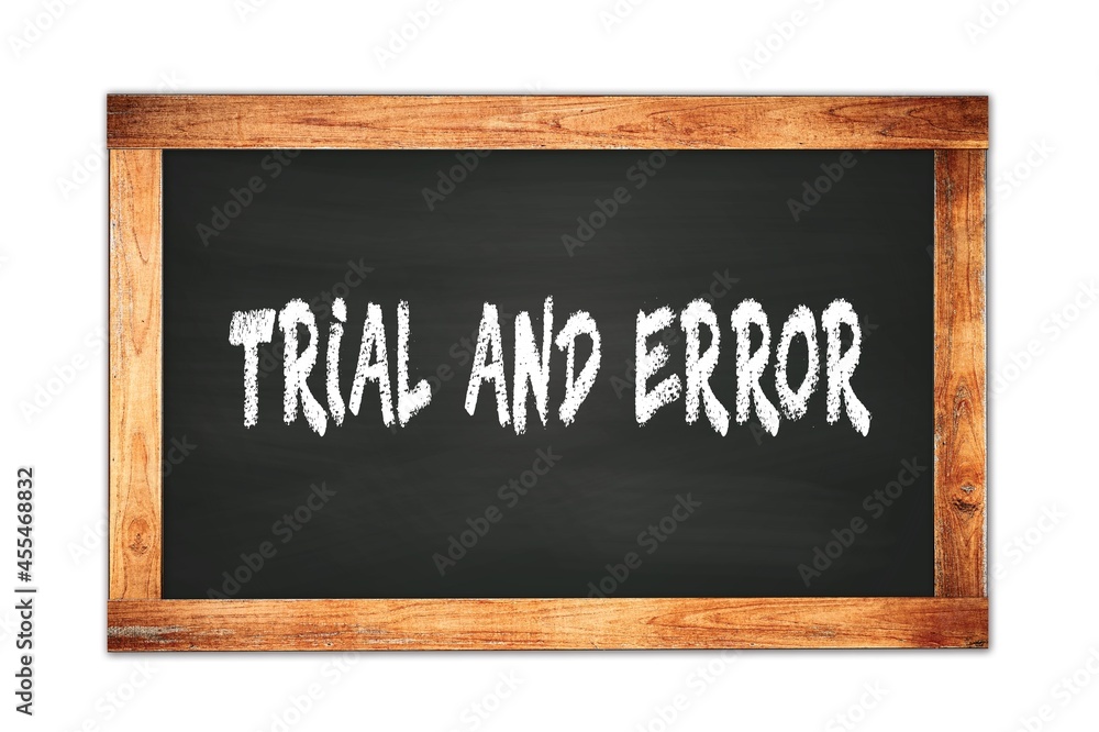 TRIAL AND ERROR text written on wooden frame school blackboard. TRIAL AND ERROR text written on wooden frame school blackboard.