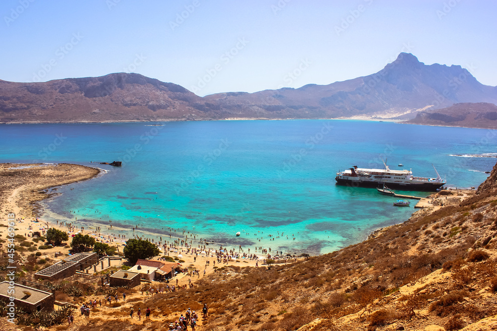 Fototapeta premium Balos Island Crete, Greece. May 1, 2015. Sea voyage on a sightseeing touristic ship. Amazing view from the mountain on blue water of Mediterranean Sea. Natural landscape. Gramvousa lagoon scenic view