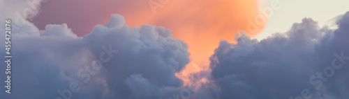 Beautiful colored clouds on sky at sunset. Close-up view. Background picturesque texture