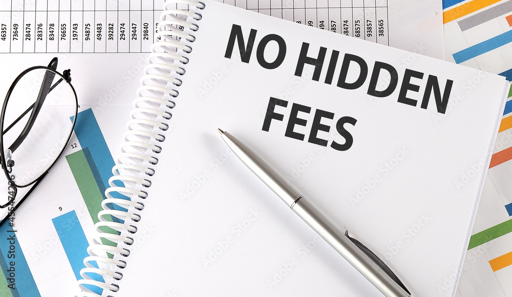 NO HIDDEN FEES text , pen and glasses on chart NO HIDDEN FEES text , pen and glasses on chart