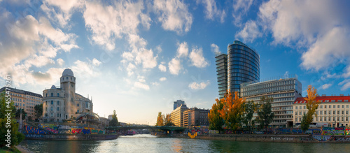 vienna, austria - OCT 17, 2019: cityscape of vienna with danube channel. beautiful urban scenery in evening light. gorgeous sky above the skyline photo
