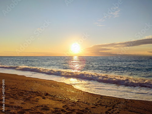 Sunset sun on sandy beach on coast of Lefkada island in Greece. Summer nature vacation travel to Ionian Sea
