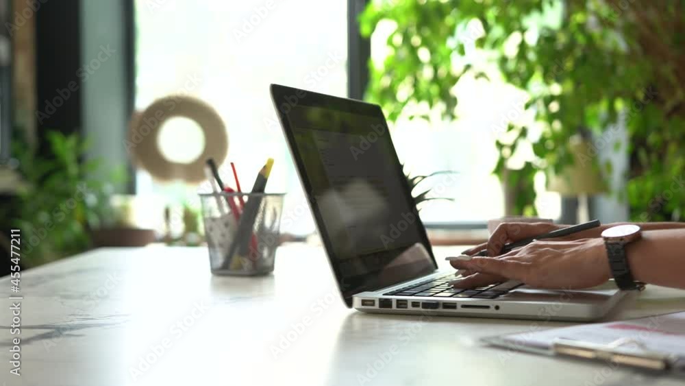 Confident Businesswoman Working on a Laptop in Her Modern Office. Stylish Beautiful Woman Doing Important Job Confident Businesswoman Working on a Laptop in Her Modern Office. Stylish Beautiful Woman Doing Important Job