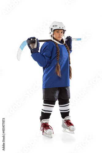 Photography Full-length vertical portrait of young female hockey player in blue uniform, wit