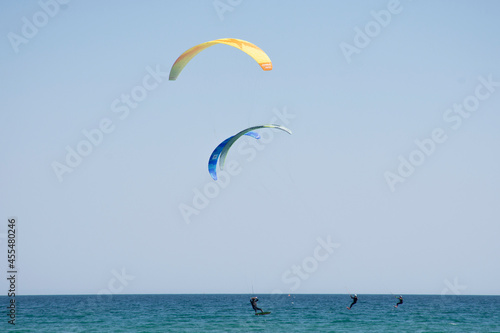 A man practicing Kitesurfing in the ocean