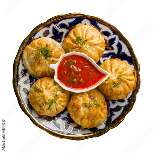 fried manty with tomato sauce uzbek cuisine isolated on white background top view photo