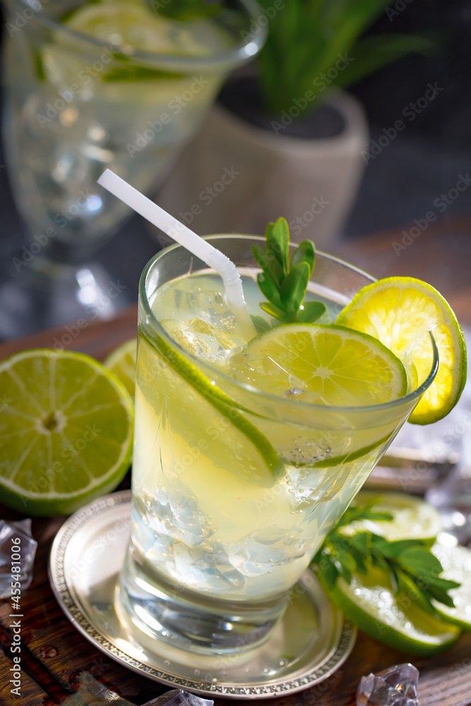 Fruit cocktail, in a glass with natural healthy fruits on a table with kitchen accessories.