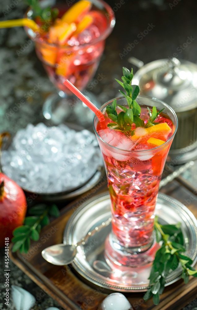 Fruit cocktail, in a glass with natural healthy fruits on a table with kitchen accessories. Fruit cocktail, in a glass with natural healthy fruits on a table with kitchen accessories.